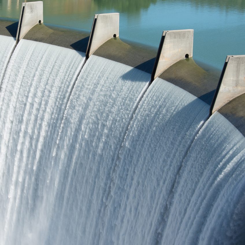 Close up of dam with water flowing over